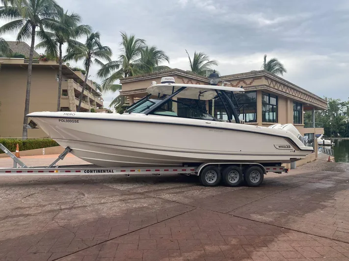 2023 Boston Whaler 320vantage @ Puerto Vallarta Yacht Photos Pics Boston Whaler 320 Vantage 2023 on trailer with tropical backdrop.