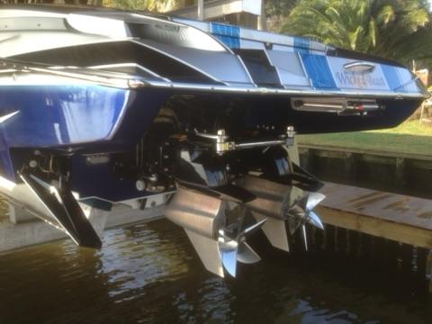 2013 Nor-Tech 477 SPX Vee Bottom boat with dual propellers, docked near water.
