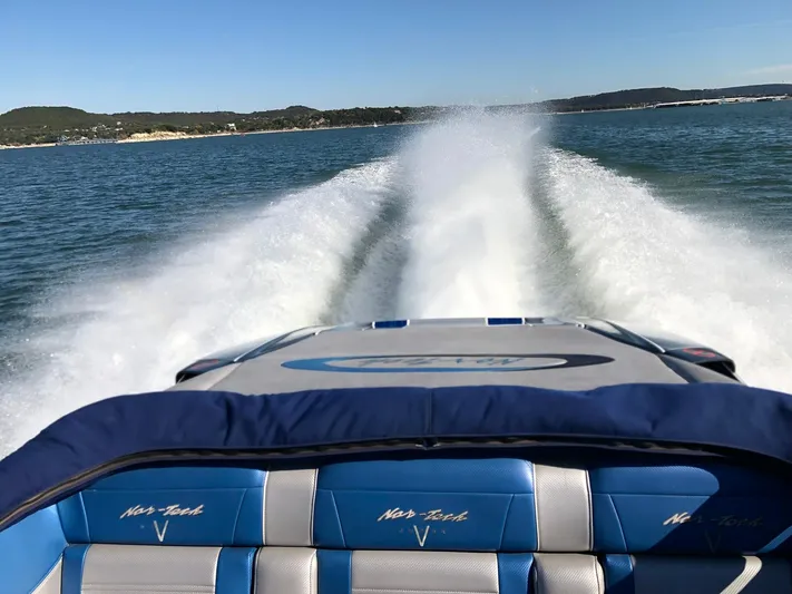 Yacht Photos Pics Nor-Tech 477 SPX Vee Bottom 2013 speedboat cruising on open water, leaving a wake trail.