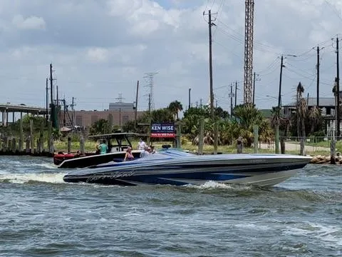  Yacht Photos Pics 2013 Nor-Tech 477 SPX Vee Bottom speedboat cruising on a sunny day.