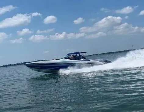  Yacht Photos Pics 2013 Nor-Tech 477 SPX Vee Bottom speedboat cruising on open water under a clear sky.