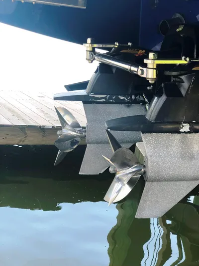  Yacht Photos Pics 2013 Nor-Tech 477 SPX Vee Bottom boat propellers near dock.
