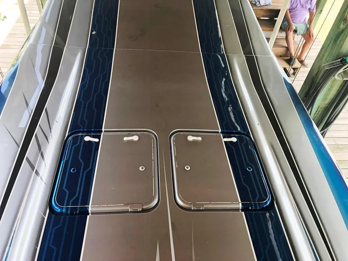  Yacht Photos Pics 2013 Nor-Tech 477 SPX Vee Bottom boat deck with sleek design and storage hatches.