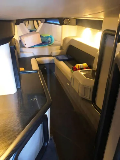  Yacht Photos Pics Interior of 2013 Nor-Tech 477 SPX Vee Bottom boat, featuring seating and storage areas.