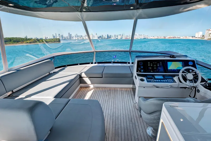 Misty K Yacht Photos Pics Luxurious 2024 Sunseeker 76 Yacht cockpit with city skyline view.