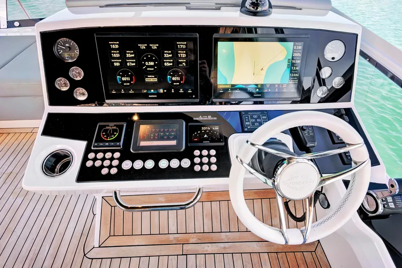 Misty K Yacht Photos Pics 2024 Sunseeker 76 Yacht helm with advanced navigation and control systems.