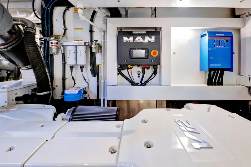 Misty K Yacht Photos Pics Engine room of 2024 Sunseeker 76 Yacht featuring MAN control panel and equipment.