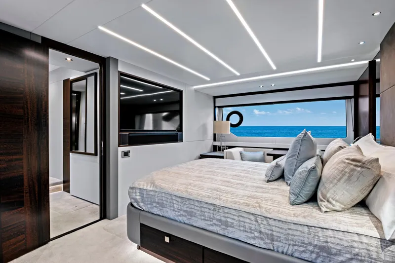 Misty K Yacht Photos Pics Luxurious bedroom interior of 2024 Sunseeker 76 Yacht with ocean view.