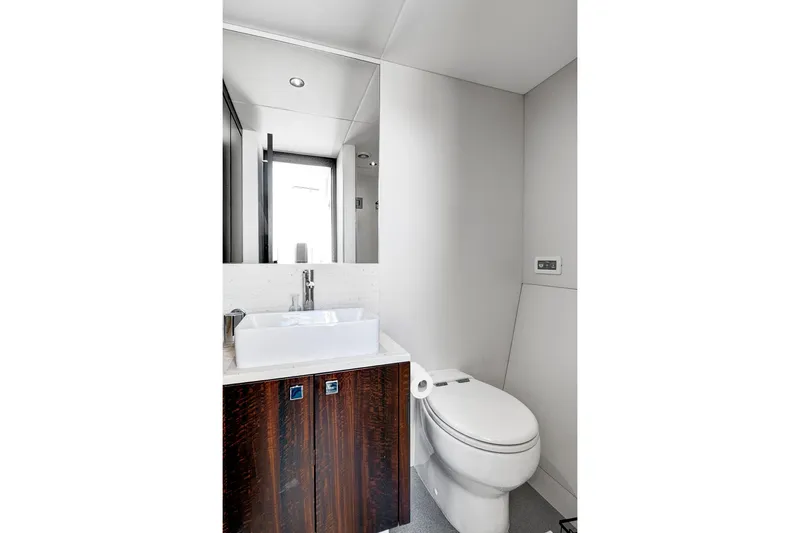 Misty K Yacht Photos Pics Luxurious bathroom in 2024 Sunseeker 76 Yacht with modern fixtures and elegant design.