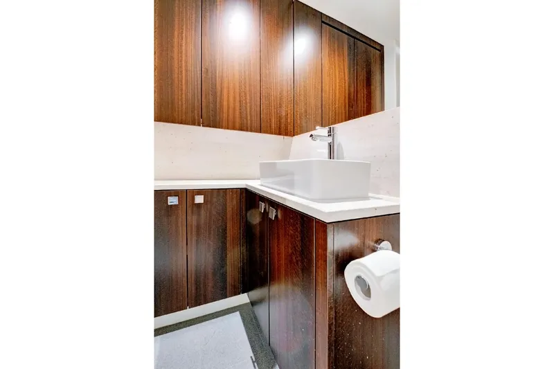 Misty K Yacht Photos Pics Luxurious bathroom with wooden cabinets in 2024 Sunseeker 76 Yacht.