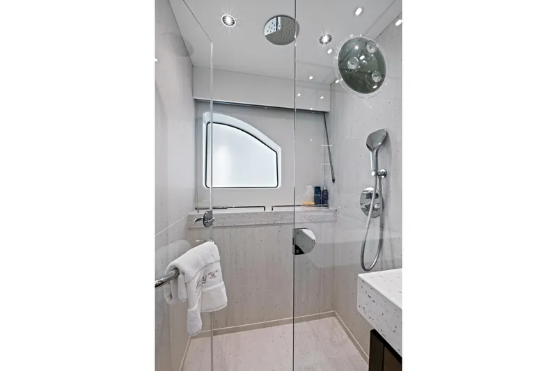 Misty K Yacht Photos Pics Luxurious bathroom in 2024 Sunseeker 76 Yacht with modern shower and elegant design.