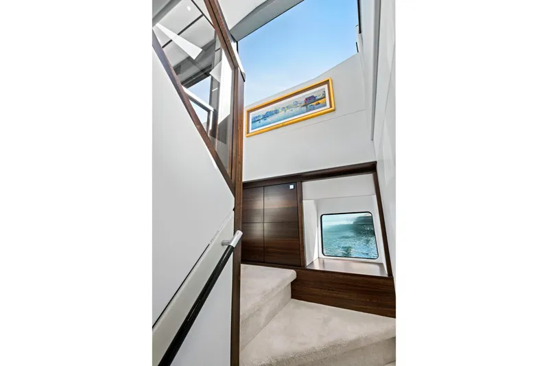 Misty K Yacht Photos Pics Interior staircase of 2024 Sunseeker 76 Yacht with modern design and ocean view.