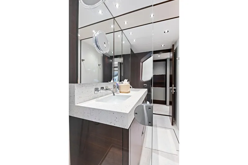 Misty K Yacht Photos Pics Luxurious bathroom in 2024 Sunseeker 76 Yacht with modern fixtures and elegant design.