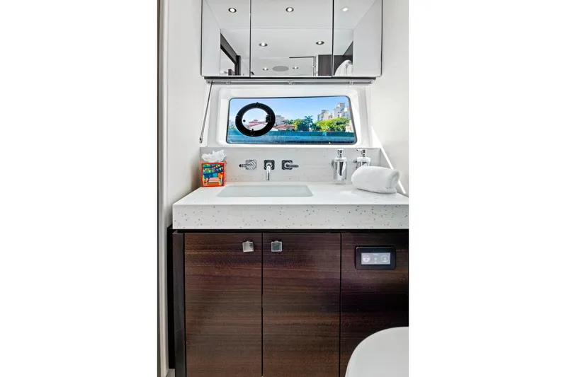 Misty K Yacht Photos Pics Luxurious bathroom interior of 2024 Sunseeker 76 Yacht with modern fixtures and ocean view.