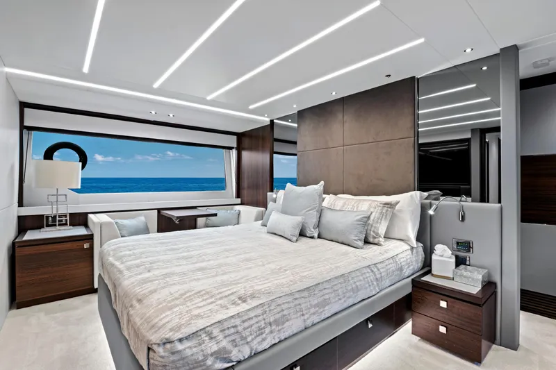 Misty K Yacht Photos Pics Luxurious bedroom interior of 2024 Sunseeker 76 Yacht with ocean view.