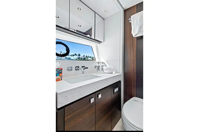 Misty K Yacht Photos Pics Luxurious bathroom interior of 2024 Sunseeker 76 Yacht with modern fixtures and ocean view.