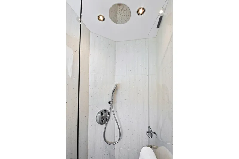 Misty K Yacht Photos Pics Luxurious shower in 2024 Sunseeker 76 Yacht, featuring modern fixtures and elegant design.