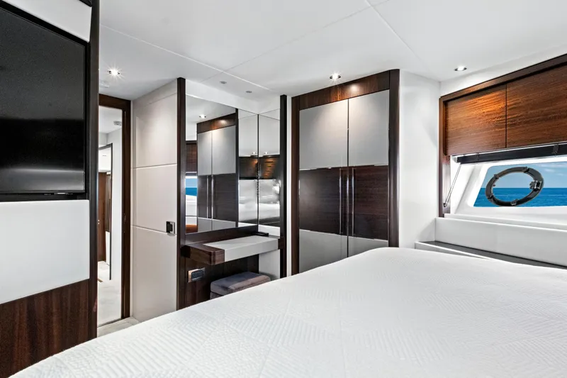 Misty K Yacht Photos Pics Luxurious interior of 2024 Sunseeker 76 Yacht bedroom with modern design and ocean view.