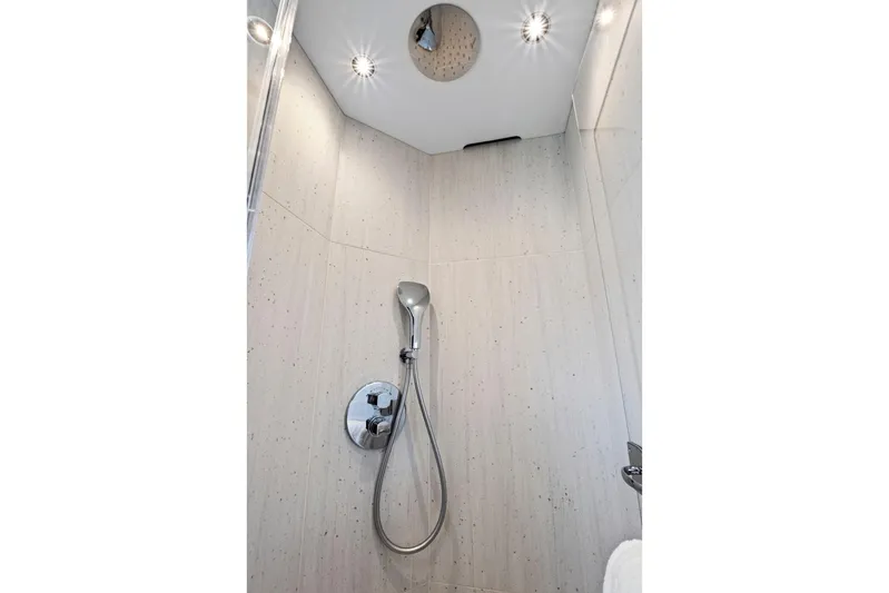 Misty K Yacht Photos Pics Modern shower in 2024 Sunseeker 76 Yacht, featuring sleek design and chrome fixtures.