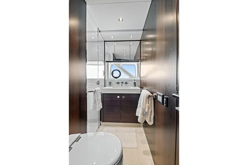 Misty K Yacht Photos Pics Luxurious bathroom interior of 2024 Sunseeker 76 Yacht with modern fixtures and elegant design.