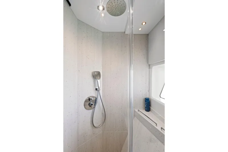 Misty K Yacht Photos Pics Luxurious shower in 2024 Sunseeker 76 Yacht, featuring modern fixtures and elegant design.