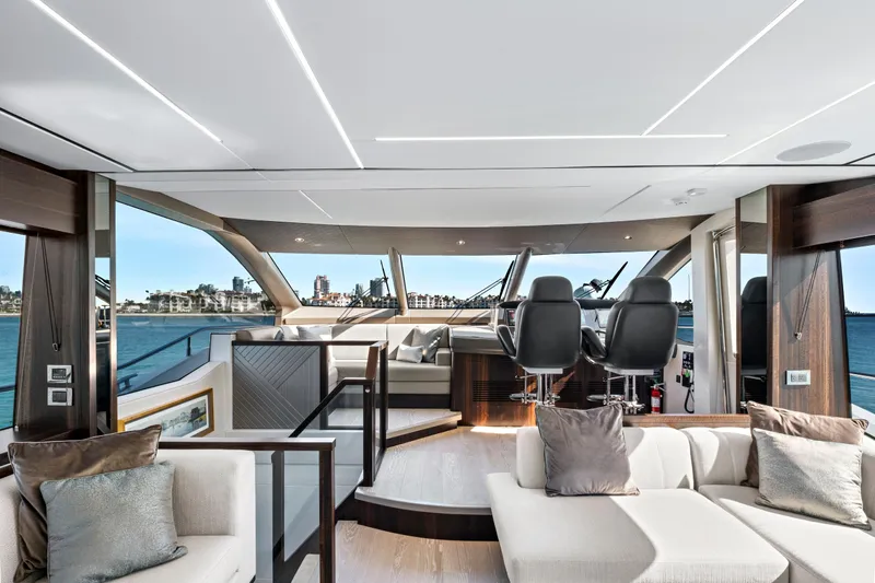 Misty K Yacht Photos Pics Luxurious interior of 2024 Sunseeker 76 Yacht with modern helm and plush seating.