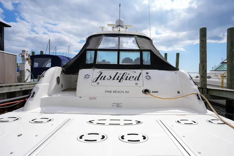  Yacht Photos Pics Sea Ray 500 Sundancer 2010 docked, rear view with Justified name and Pine Beach, NJ location.