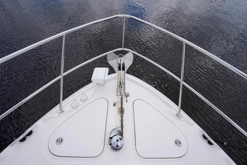  Yacht Photos Pics Bow of 2010 Sea Ray 500 Sundancer yacht on calm water.