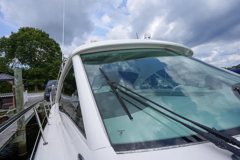  Yacht Photos Pics Close-up of 2010 Sea Ray 500 Sundancer yacht docked at marina.