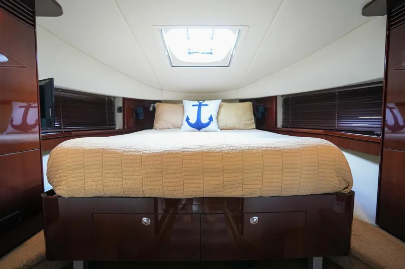  Yacht Photos Pics Luxurious bedroom in 2010 Sea Ray 500 Sundancer yacht with skylight and anchor-themed pillow.