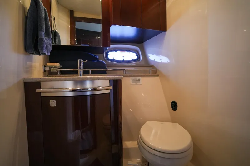  Yacht Photos Pics 2010 Sea Ray 500 Sundancer yacht bathroom with sink, toilet, and porthole window.