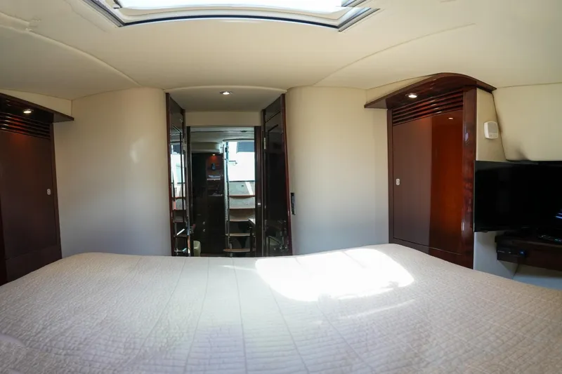  Yacht Photos Pics Luxurious bedroom interior of 2010 Sea Ray 500 Sundancer yacht with skylight.