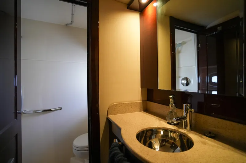  Yacht Photos Pics Luxurious bathroom in 2010 Sea Ray 500 Sundancer yacht with modern fixtures and elegant design.