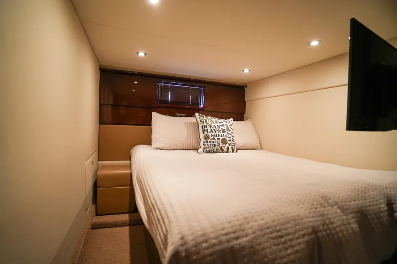  Yacht Photos Pics 2010 Sea Ray 500 Sundancer cozy bedroom with modern lighting and comfortable bedding.