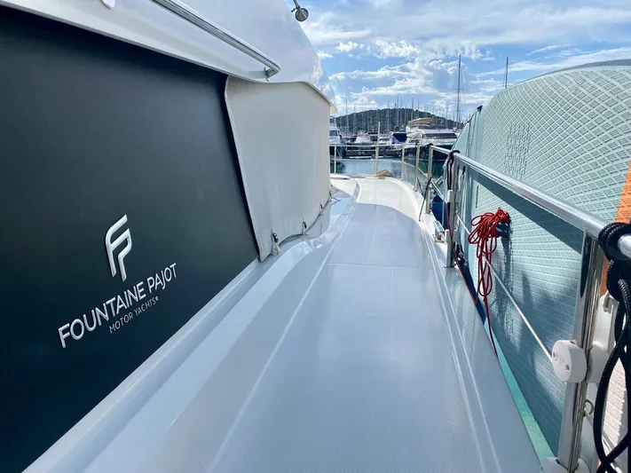  Yacht Photos Pics 2021 Fountaine Pajot MY6 yacht docked, showcasing sleek design and marina view.