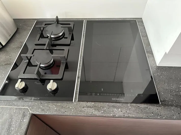  Yacht Photos Pics Modern kitchen with Bosch gas stove and Siemens induction cooktop on a Fountaine Pajot MY6.