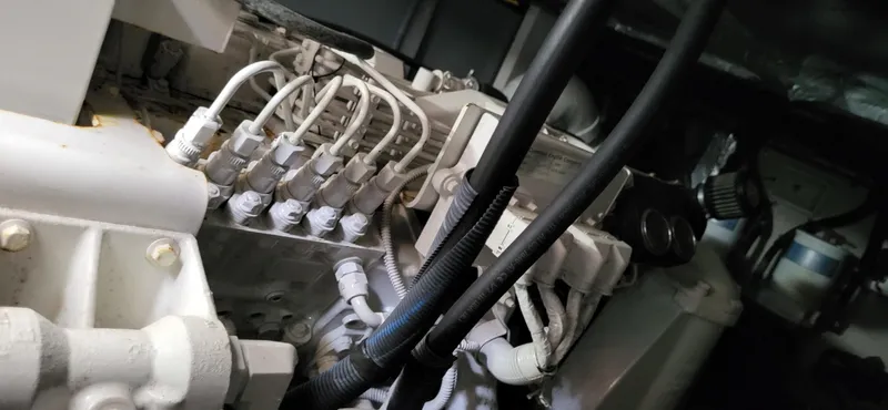  Yacht Photos Pics Engine compartment of a 2005 Sea Ray 390 Motor Yacht, showcasing intricate wiring and components.