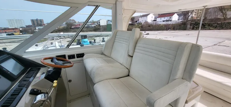  Yacht Photos Pics 2005 Sea Ray 390 Motor Yacht interior with plush seating and modern helm controls.