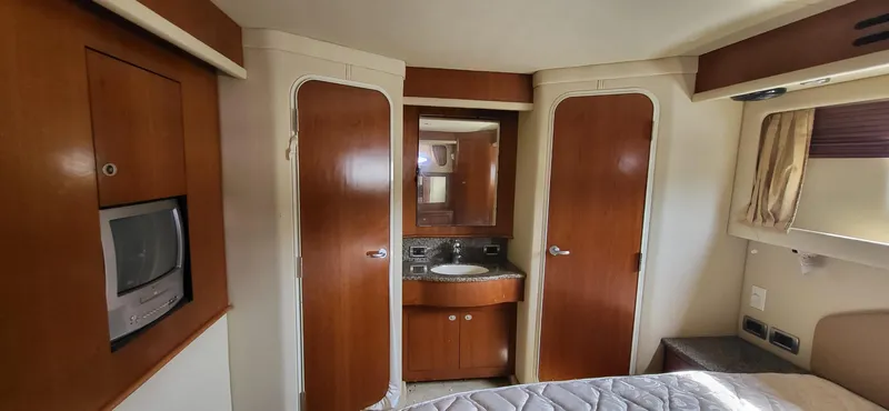  Yacht Photos Pics Interior of 2005 Sea Ray 390 Motor Yacht with wood finishes and compact amenities.