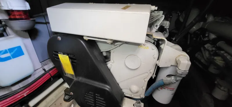  Yacht Photos Pics Engine room of a 2005 Sea Ray 390 Motor Yacht, showcasing mechanical components and wiring.