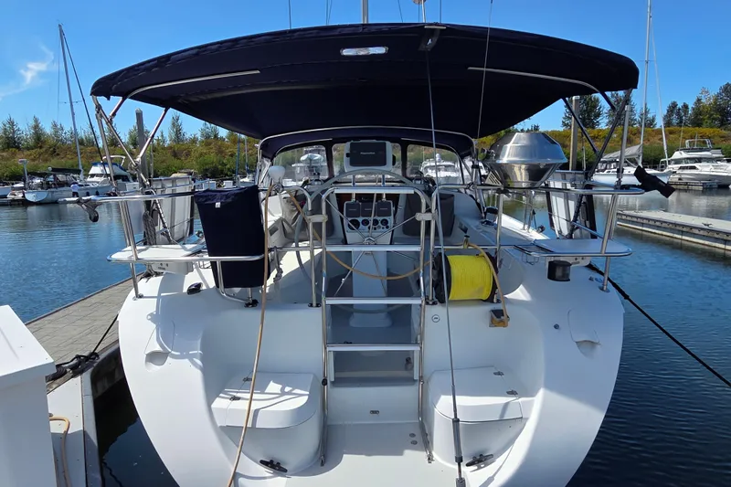  Yacht Photos Pics 2007 Catalina 42 MkII sailboat docked at marina, featuring spacious cockpit and canopy.