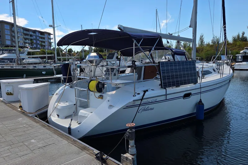  Yacht Photos Pics 2007 Catalina 42 MkII sailboat docked, featuring solar panels and a spacious deck.