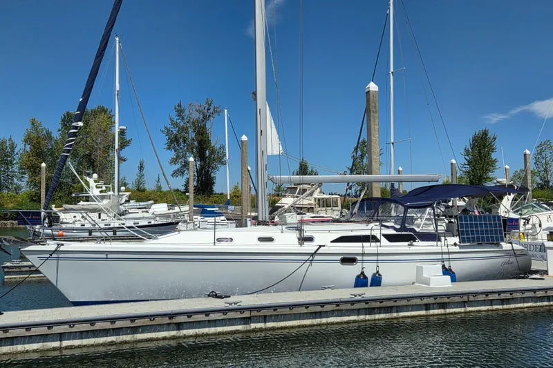  Yacht Photos Pics 2007 Catalina 42 MkII sailboat docked at marina under clear blue sky.
