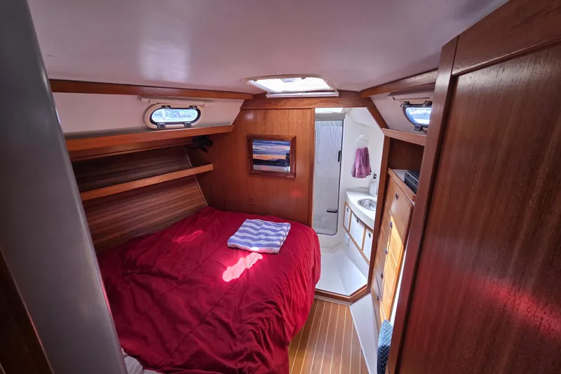  Yacht Photos Pics Cozy cabin interior of 2007 Catalina 42 MkII sailboat with bed and bathroom.