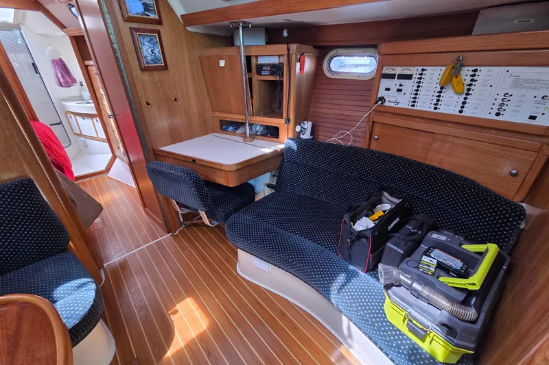  Yacht Photos Pics Interior of a 2007 Catalina 42 MkII sailboat with seating, table, and control panel.