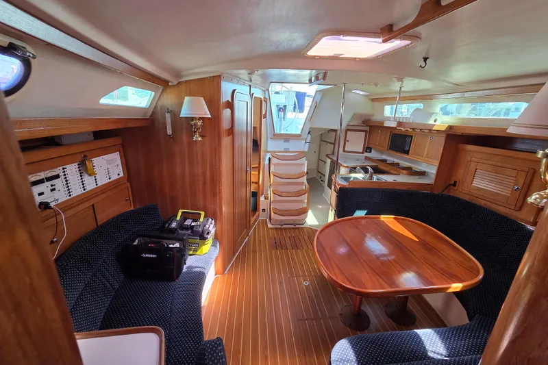  Yacht Photos Pics Interior of 2007 Catalina 42 MkII sailboat with wood finish and cozy seating area.