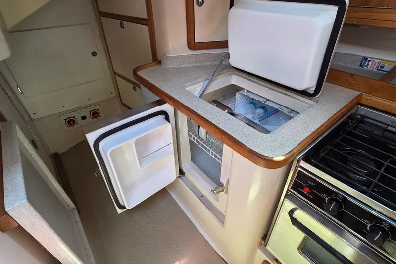  Yacht Photos Pics 2007 Catalina 42 MkII yacht kitchen with open fridge and stove.