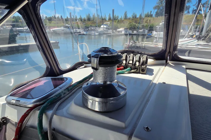  Yacht Photos Pics Cockpit view of 2007 Catalina 42 MkII sailboat in marina, featuring winch and ropes.
