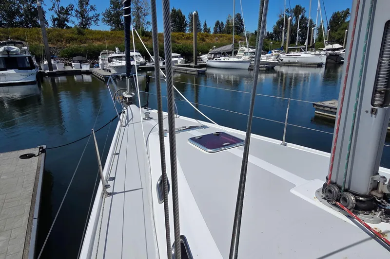  Yacht Photos Pics 2007 Catalina 42 MkII sailboat docked in a marina, surrounded by other boats.