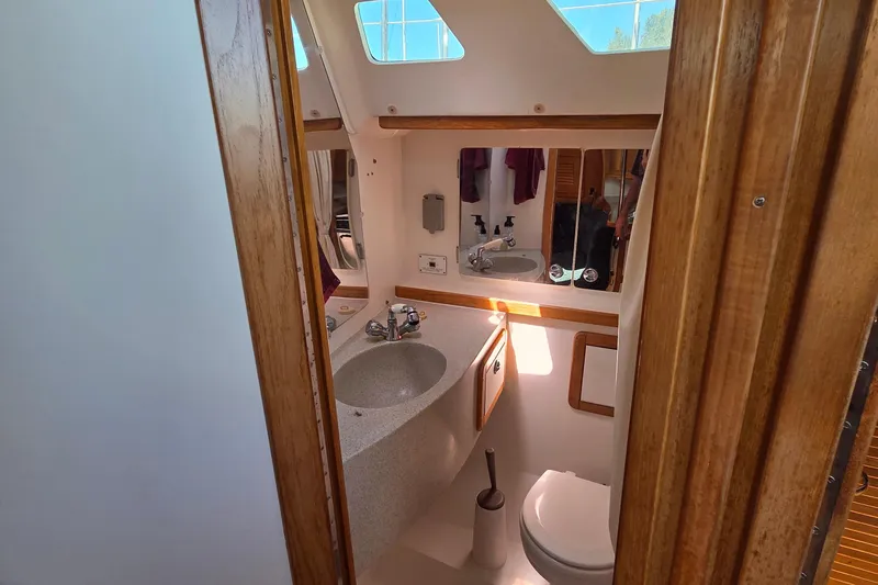 Yacht Photos Pics Bathroom interior of 2007 Catalina 42 MkII sailboat with sink and toilet.
